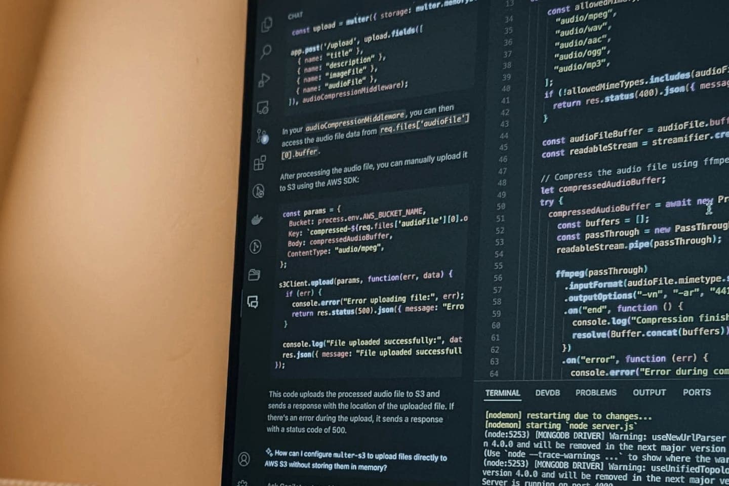 Source code on a monitor in a developer's workspace